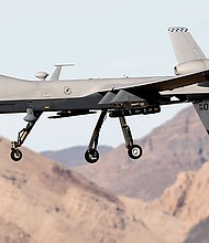 In this 2015 file photo, an MQ-9 Reaper remotely piloted aircraft flies by during a training mission at Creech Air Force Base in Indian Springs, Nevada.
Mandatory Credit:	Isaac Brekken/Getty Images/File