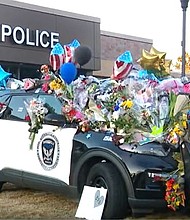 A crowd gathered outside the Burnsville police department to honor fallen first responders.
Mandatory Credit:	WCCO via CNN Newsource