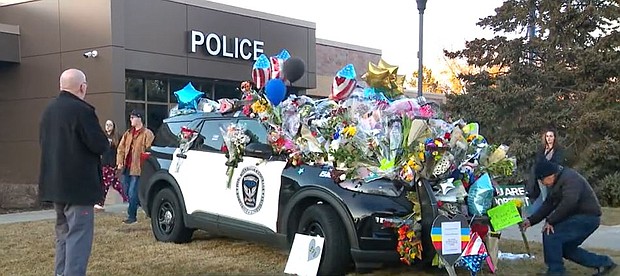 A crowd gathered outside the Burnsville police department to honor fallen first responders.
Mandatory Credit:	WCCO via CNN Newsource