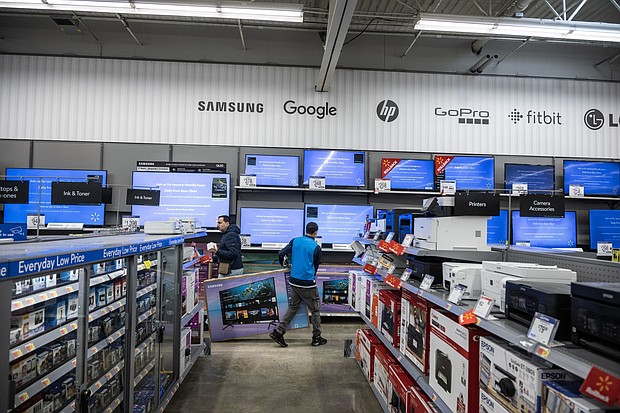 A worker stocks televisions at a Walmart store on Black Friday in Secaucus, New Jersey, US, on Friday, Nov. 24, 2023.
Mandatory Credit:	Victor J. Blue/Bloomberg/Getty Images via CNN Newsource