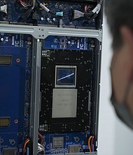 A person looking at the NVIDIA Grace Hopper superchip at Gigabyte booth at COMPUTEX 2023 in Taipei.
Mandatory Credit:	Walid Berrazeg/SOPA Images/LightRocket/Getty Images/File via CNN Newsource