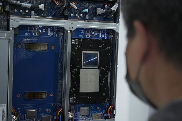 A person looking at the NVIDIA Grace Hopper superchip at Gigabyte booth at COMPUTEX 2023 in Taipei.
Mandatory Credit:	Walid Berrazeg/SOPA Images/LightRocket/Getty Images/File via CNN Newsource