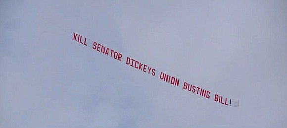 Some Iowa teamsters descended Wednesday on the Iowa Statehouse, pushing back against a bill they say weakens Iowa unions.