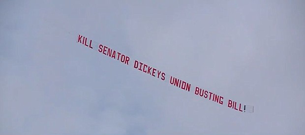 Some Iowa teamsters descended on the Iowa Statehouse, pushing back against a bill they say weakens Iowa unions by using a plane flying around the Capitol reading "Kill Senator Dickey's Union Busting Bill."
Mandatory Credit:	KCCI via CNN Newsource