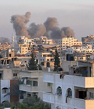 A picture taken in Gaza City shows smoke billowing in the background during Israeli bombardment on February 20, 2024, amid continuing battles between Israel and the Palestinian militant group Hamas.
Mandatory Credit:	AFP/Getty Images via CNN Newsource
