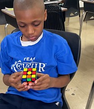 Tarron Nelson can complete a Rubik’s Cube in less than 2 minutes with a record time of 43 seconds.
Mandatory Credit: