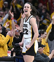 Clark celebrates after becoming women's college basketball's leading scorer.
Mandatory Credit:	Jeffrey Becker/USA TODAY Sports/Reuters via CNN Newsource