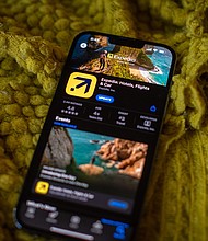 Expedia is laying off thousands of employees.
Mandatory Credit:	Tiffany Hagler-Geard/Bloomberg/Getty Images via CNN Newsource