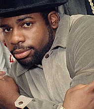 File image of Run-D.M.C.'s Jason Mizell, Jam-Master Jay, posing with teenagers gathered at New York's Madison Square Garden, October 7, 1986, in New York City
Mandatory Credit:	G. Paul Burnett/AP via CNN Newsource