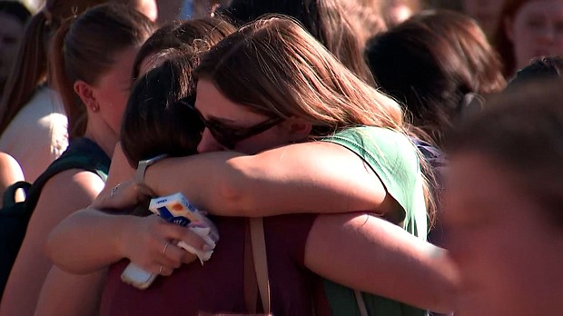 People hug at a vigil for Laken Hope Riley at the University of Georgia in Athens, Georgia, on February 26.
Mandatory Credit:	WANF via CNN Newsource
