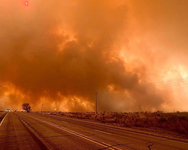 A wildfire burns northwest of Canadian, Texas, on Tuesday, February 27.
Mandatory Credit:	Courtesy Miguel Lira/Booker Grocery Cafe & Catering via CNN Newsource