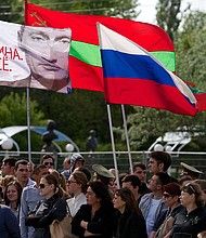Pro-Russian rebels in Tiraspol have asked Russia for protection. The rebels are seen here waving the Transnistrian and Russian flags, in 2014.
Mandatory Credit:	Vadim Denisov/AFP/Getty Images via CNN Newsource