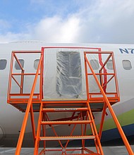 In this National Transportation Safety Board (NTSB) handout, plastic covers the exterior of the fuselage plug area of Alaska Airlines Flight 1282 Boeing 737-9 MAX on January 7, 2024 in Portland, Oregon.
Mandatory Credit:	Handout/Getty Images via CNN Newsource