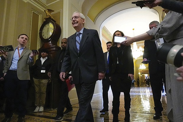 Senate Minority Leader Mitch McConnell of Kentucky walks off the Senate floor after speaking Wednesday at the Capitol in Washington. Mr. McConnell says he’ll step down as Senate Republican leader in November. The 82-year-old lawmaker is the longest-serving Senate leader in history. He’s maintained his power in the face of dramatic changes in the Republican Party.