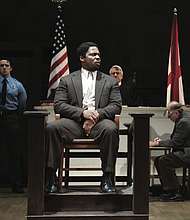 Yaegel T. Welch as Tom Robinson takes the stand in the stage adaptation of “To Kill a Mockingbird.”
