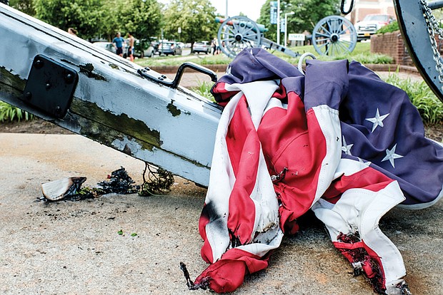 A tattered American flag lays on the ground in May 2020 on the property of the United
Daughters of the Confederacy headquarters in Richmond. The Democratic-led Virginia
House of Delegates gave final passage Monday to a bill that would eliminate both a
recordation and property tax exemption for the United Daughters of the Confederacy,
and its now on its way to Republican Gov. Glenn Youngkin, who hasn’t said whether he
supports it.