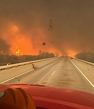 At least 1 dead as large wildfires sweep through the Texas panhandle.
Mandatory Credit:	Greenville Fire-Rescue via CNN Newsource