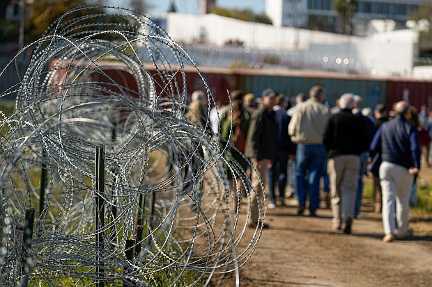 Members of Congress tour an area lined with concertina wire in Eagle Pass on January 3, a week before Texas blocked Border Patrol agents from parts of the city.
Mandatory Credit:	Eric Gay/AP via CNN Newsource
