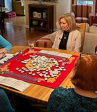 John King observes Easton, Pennsylvania, resident Darrell Ann Murphy and friends playing Mahjong at her home.
Mandatory Credit:	CNN via CNN Newsource