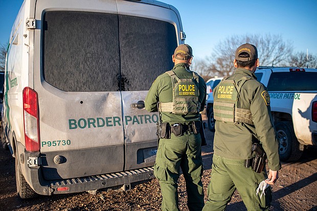 A federal judge suspended a controversial law that allowed state law enforcement agents to arrest and detain people they suspect of entering the country illegally. Border Patrol officers are shown here processing a group of about 60 migrants near the highway on February 4, 2024 outside Eagle Pass, Texas.
Mandatory Credit:	Sergio Flores/AFP/Getty Images via CNN Newsource