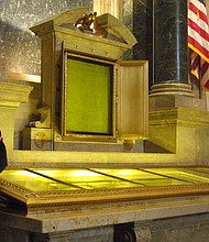 In this file photo, an honor guard stands next to the Declaration of Independence, the Constitution, and the Bill of Rights in the National Archives in Washington, DC. Two people were charged after they allegedly dumped red powder over the display case.
Mandatory Credit:	Alex Wong/Getty Images/File via CNN Newsource