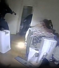 An image taken from body camera video shows the moments police in Illinois shot and killed a man inside his apartment bedroom.
Mandatory Credit:	Carol Stream Police Department via CNN Newsource