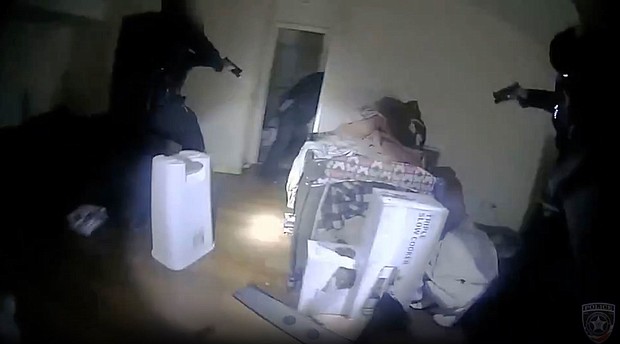 An image taken from body camera video shows the moments police in Illinois shot and killed a man inside his apartment bedroom.
Mandatory Credit:	Carol Stream Police Department via CNN Newsource