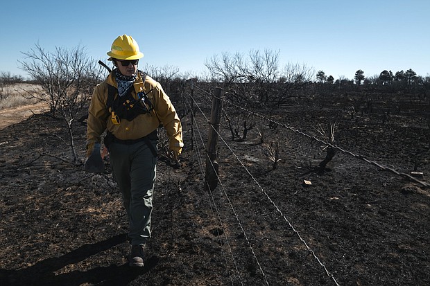 Fire crews work to extinguish hot spots following the Smokehouse Creek Fire in Fritch, Texas, on Friday, March 1, 2024.
Mandatory Credit:	Jordan Vonderhaar/Bloomberg/Getty Images via CNN Newsource