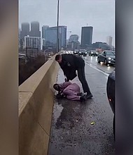 A still from a video shows a Pennsylvania state trooper detaining Darius McLean, husband of Philadelphia's head of LGBT Affairs, Celena Morrison.
Mandatory Credit:	LaTasha Morrison Sinclair/Facebook via CNN Newsource