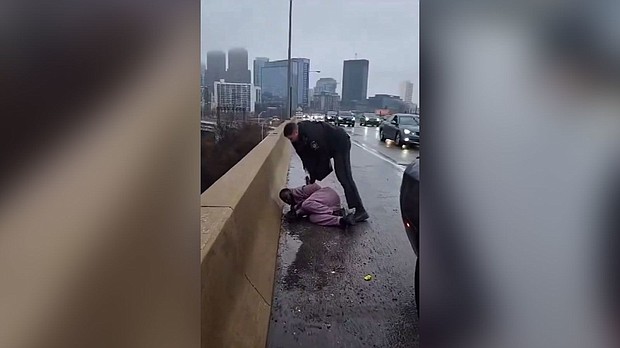 A still from a video shows a Pennsylvania state trooper detaining Darius McLean, husband of Philadelphia's head of LGBT Affairs, Celena Morrison.
Mandatory Credit:	LaTasha Morrison Sinclair/Facebook via CNN Newsource
