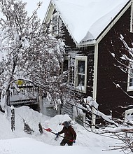 A worker digs out snow from a home north of Lake Tahoe during a powerful multiple day winter storm in the Sierra Nevada on March 02, in Truckee, California.
Mandatory Credit:	Mario Tama/Getty Images via CNN Newsource