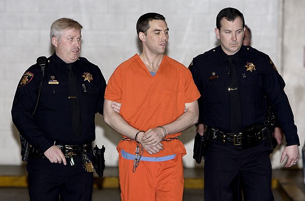 Convicted murderer Scott Peterson is escorted from jail on March 17, 2005, in Redwood City, California.
Mandatory Credit:	Justin Sullivan/Getty Images via CNN Newsource
