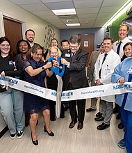 Harris Health Chief Operating Officer Louis Smith and Harris Health Board of Trustees Chair Andrea Caracostis, MD, jointly cut the ribbon on March 6, 2024 to dedicate the Harris Health Endoscopy Center at Quentin Mease Health Center.