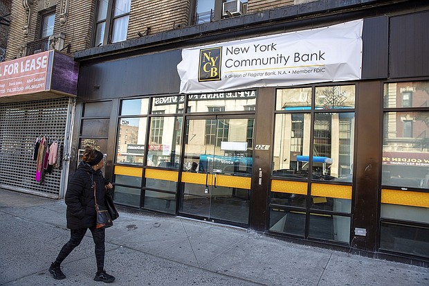 New York Community Bank customers withdrew $6 billion in one month.
Mandatory Credit:	Ted Shaffrey/AP via CNN Newsource
