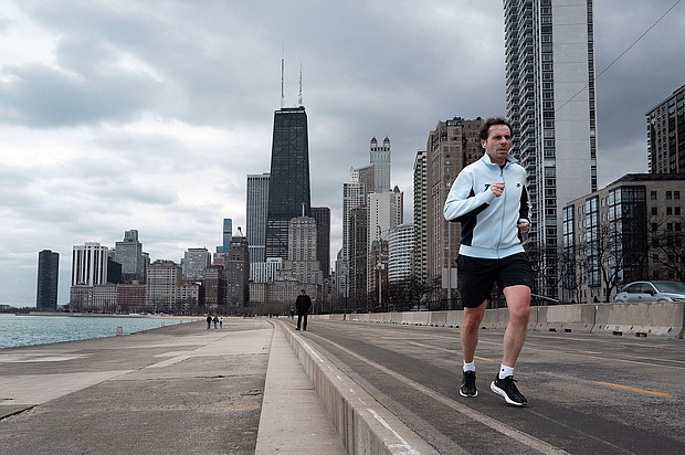 A jogger runs along Lake Michigan as temperature climbed to near 60 degrees, more than 20 degrees above normal on February 08, in Chicago, Illinois.
Mandatory Credit:	Scott Olson/Getty Images via CNN Newsource
