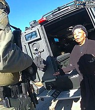 This image taken from Denver Police body camera footage provided by the American Civil Liberties Union of Colorado shows Ruby Johnson, a 78-year-old Colorado woman, surrounded by SWAT officers, Jan. 4, 2022, in Colorado. Johnson, who sued two police officers after her home was wrongly searched by a SWAT team looking for a stolen truck, won a $3.76 million jury verdict Monday, March 4, under a new Colorado law that allows people to sue police over violations of their state constitutional rights.
Mandatory Credit:	Denver Police Department/AP via CNN Newsource