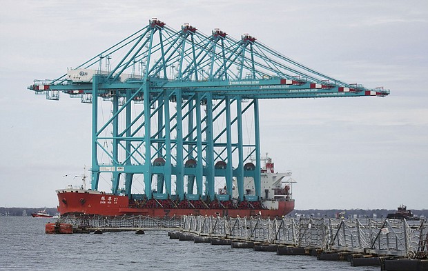 Four fully-assembled, 170-foot tall ship-to-shore ZPMC cranes on the Elizabeth River in January 2019. Some Chinese-made cranes used at US ports contain communications equipment with no clear purpose or record of their installation, according to a new congressional investigation that will heighten US concerns that the cranes could be used for surveillance or sabotage.
Mandatory Credit:	L. Todd Spencer/The Virginian-Pilot/Getty Images via CNN Newsource