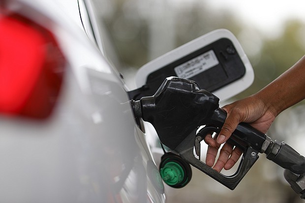 A motorist fills up with fuel at an Exxon gas station, Friday, March 1, in Houston.
Mandatory Credit:	Aaron M. Sprecher/AP via CNN Newsource