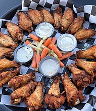 The Locker Room Sports Bar & Grill’s delicious 20pc and 50pc Wing Platters come in over 12 flavors and will be specially priced for March Madness Watch Parties./Photos by The Locker Room