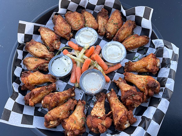 The Locker Room Sports Bar & Grill’s delicious 20pc and 50pc Wing Platters come in over 12 flavors and will be specially priced for March Madness Watch Parties./Photos by The Locker Room