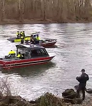 Clackamas firefighters and the Oregon City Police Department worked together to pull the body of a driver out of a car that drove into the Clackamas River.
Mandatory Credit:	KPTV via CNN Newsource