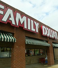 A customer walks out of a Family Dollar store at Hickory Grove Market in Charlotte, N.C., in November 2005.
Mandatory Credit:	Ross Taylor/AP via CNN Newsource