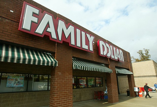 A customer walks out of a Family Dollar store at Hickory Grove Market in Charlotte, N.C., in November 2005.
Mandatory Credit:	Ross Taylor/AP via CNN Newsource