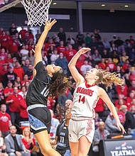 Finishing 26-4 with five one-sided playoff victories, the John Marshall Lady Justices fell short in the Class 2 finals, falling to Central Wise, 58-41, at the Siegel Center. In this photo, Kiyah Lewis leaps for the basket.