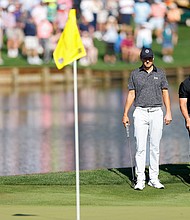 Spieth [left] and McIlroy look on at the 16th green.
Mandatory Credit:	Mike Ehrmann/Getty Images via CNN Newsource