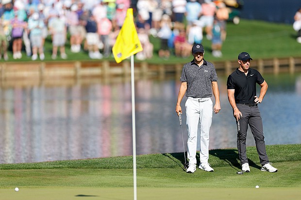 Spieth [left] and McIlroy look on at the 16th green.
Mandatory Credit:	Mike Ehrmann/Getty Images via CNN Newsource