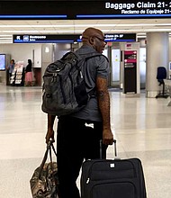 The first evacuation flight out of Cap-Haitien, Haiti, landed at Miami International Airport on Sunday. Francius St. Alma of Miami was among the passengers.
Mandatory Credit:	Carl Juste/Miami Herald/Tribune News
