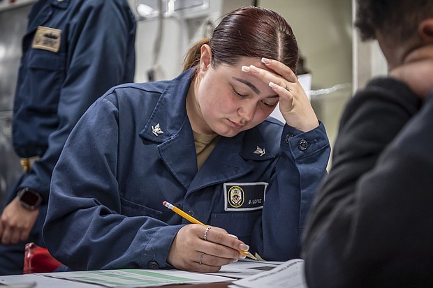 Quartermaster 3rd Class Jacklyn Lopez, a native of Houston, participates in the E-5 Navy-Wide Advancement Exam on the mess decks aboard USS Boxer (LHD 4), March 14, 2024. Boxer is a Wasp-class amphibious assault ship homeported in San Diego. (U.S. photo by Mass Communication Specialist 2nd Class James Finney)