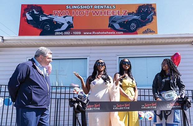 Twins Desitny Oliver and Dashia Oliver cut the ribbon for their new business, RVA Hot Wheelz Slingshot Rentals, Saturday in Henrico County. Anthony J. Romanello, a county representative, and Crystal Simmons of the Jackson Ward Collective were on hand to congratulate the women business owners.