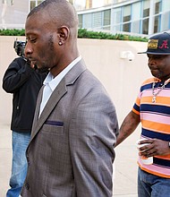 Michael Corey Jenkins, left, and Eddie Terrell Parker enter the Thad Cochran United States Courthouse in Jackson, Mississippi.
Mandatory Credit:	Rogelio V. Solis/AP via CNN Newsource